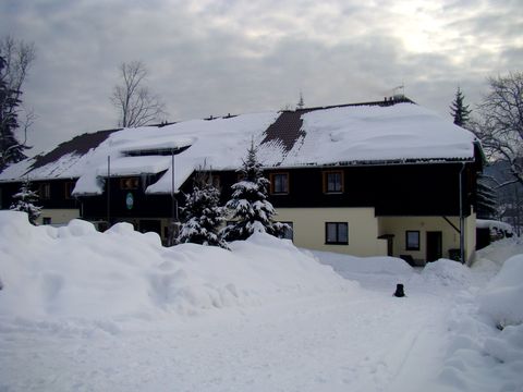 zimně oděná chata KČT v Prášilech
